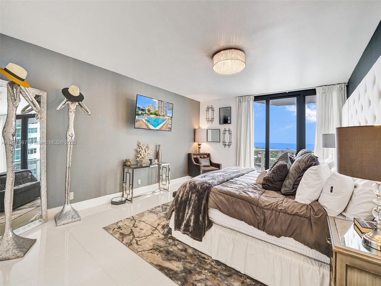 20281 East Country Club Drive, Unit 1114 Aventura, FL 33180 - Photo 34 of 87 a bedroom with a bed and a table