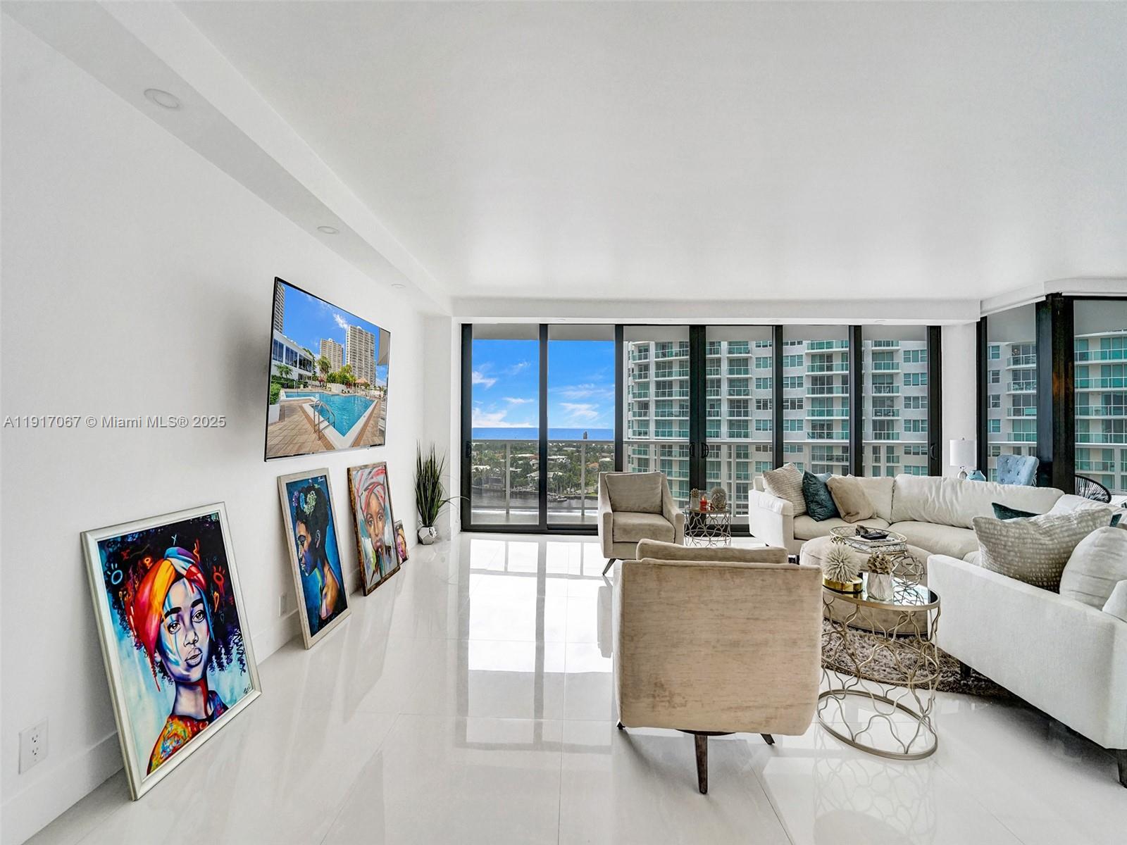 20281 East Country Club Drive, Unit 1114 Aventura, FL 33180 - Photo 7 of 87 a living room with furniture and a large window