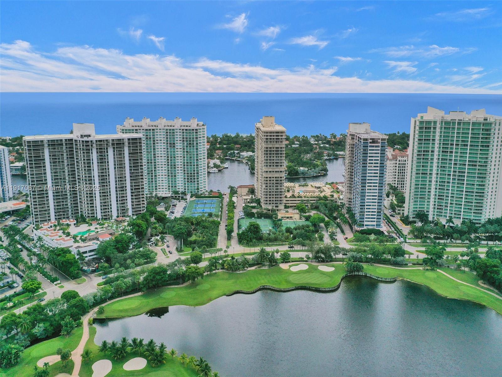 20281 East Country Club Drive, Unit 1114 Aventura, FL 33180 - Photo 83 of 87 a view of a lake with a city