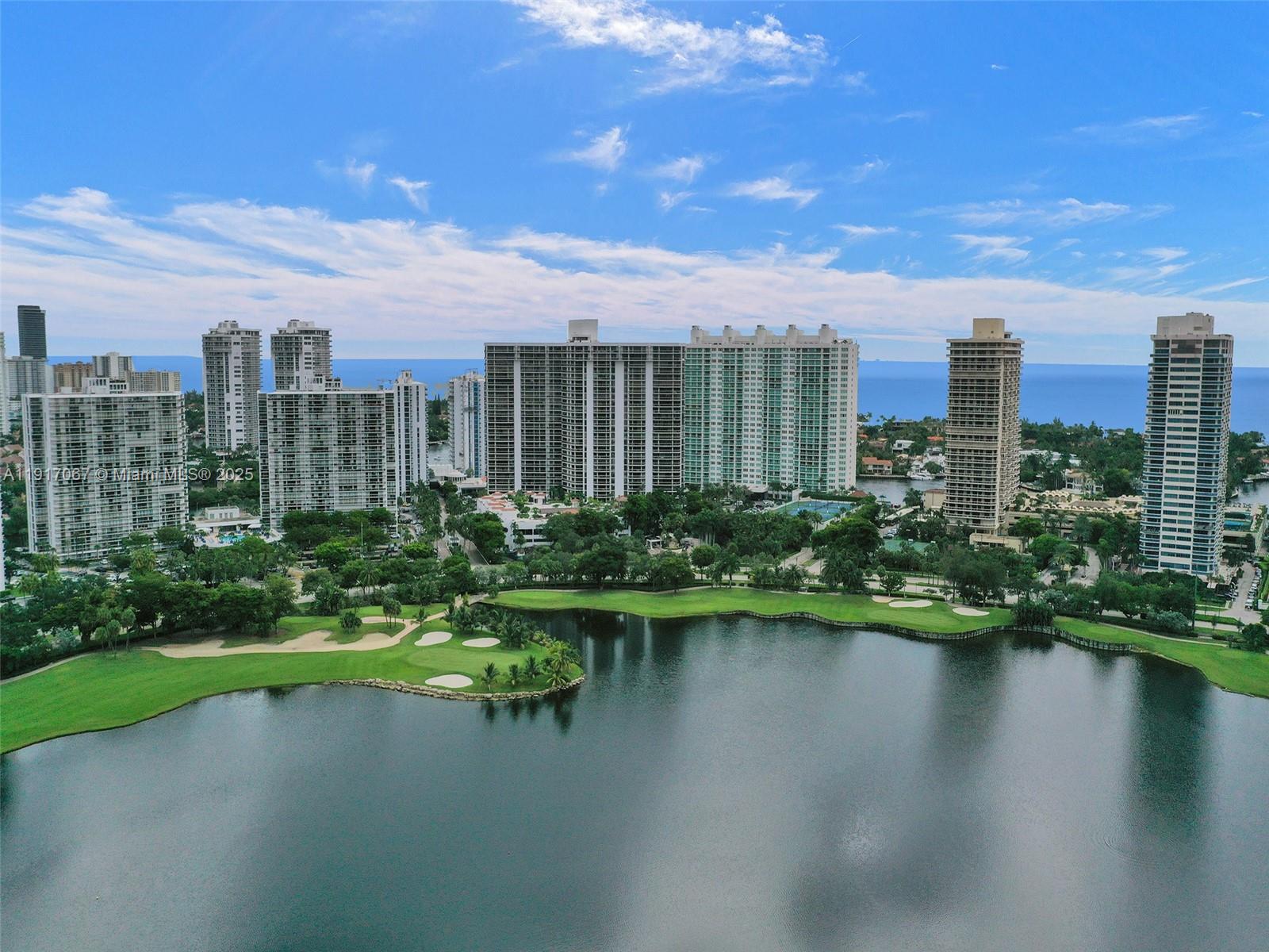 20281 East Country Club Drive, Unit 1114 Aventura, FL 33180 - Photo 86 of 87 a view of a lake with a city