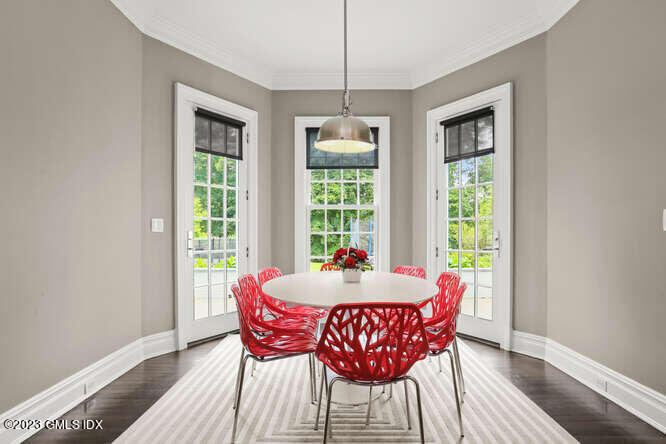 33 Boulder Brook Road Greenwich, CT 06830 - Photo 15 of 50 a dining room with furniture window and wooden floor
