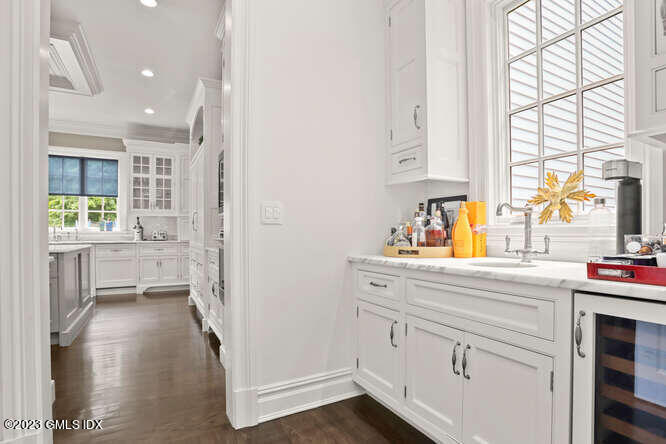 33 Boulder Brook Road Greenwich, CT 06830 - Photo 16 of 50 a kitchen with a sink cabinets appliances and a window
