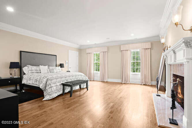 33 Boulder Brook Road Greenwich, CT 06830 - Photo 22 of 50 a spacious bedroom with a large bed and a flat screen tv