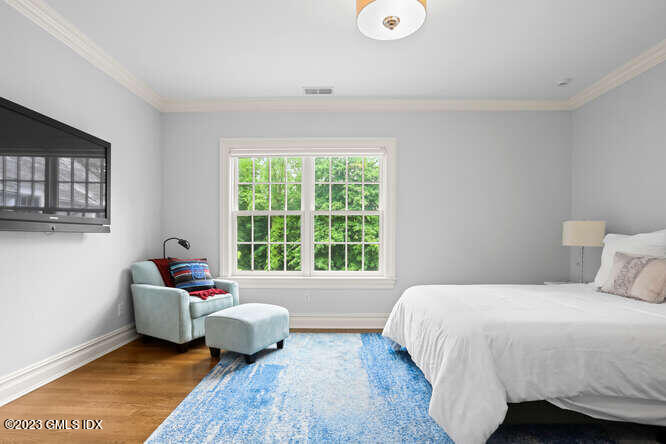 33 Boulder Brook Road Greenwich, CT 06830 - Photo 28 of 50 a bedroom with a bed and a window