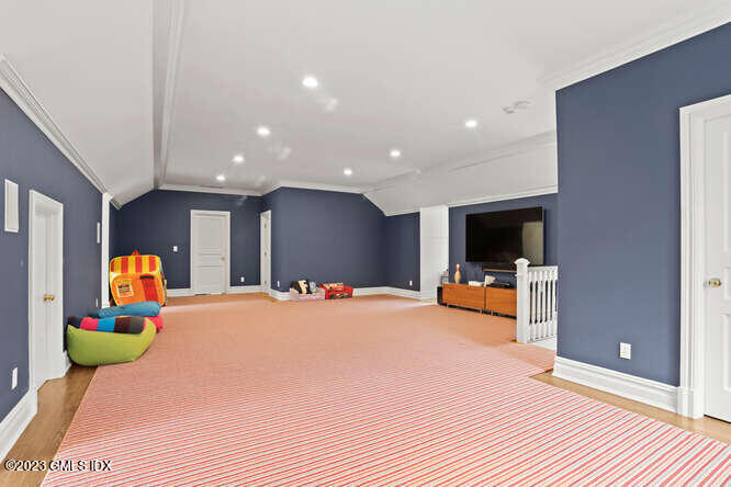 33 Boulder Brook Road Greenwich, CT 06830 - Photo 33 of 50 a bedroom with furniture and a flat screen tv