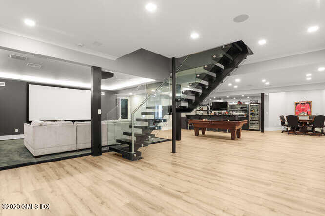 33 Boulder Brook Road Greenwich, CT 06830 - Photo 36 of 50 a room with lots of furniture and a wooden floor