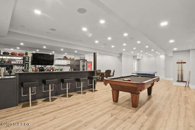 33 Boulder Brook Road Greenwich, CT 06830 - Photo 39 of 50 a room with lots of furniture and kitchen view