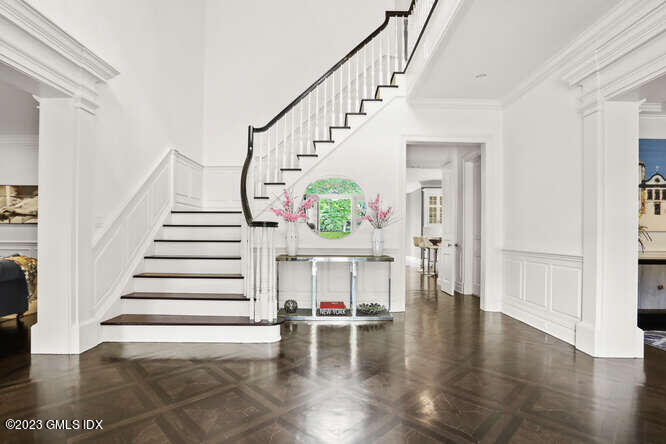 33 Boulder Brook Road Greenwich, CT 06830 - Photo 4 of 50 a view of entryway dining room and hall with wooden floor