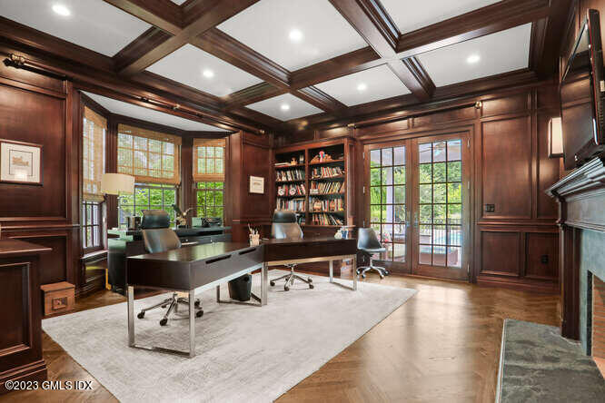 33 Boulder Brook Road Greenwich, CT 06830 - Photo 9 of 50 a living room with furniture a fireplace and large windows