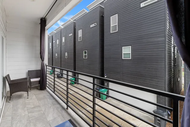 a view of balcony with furniture