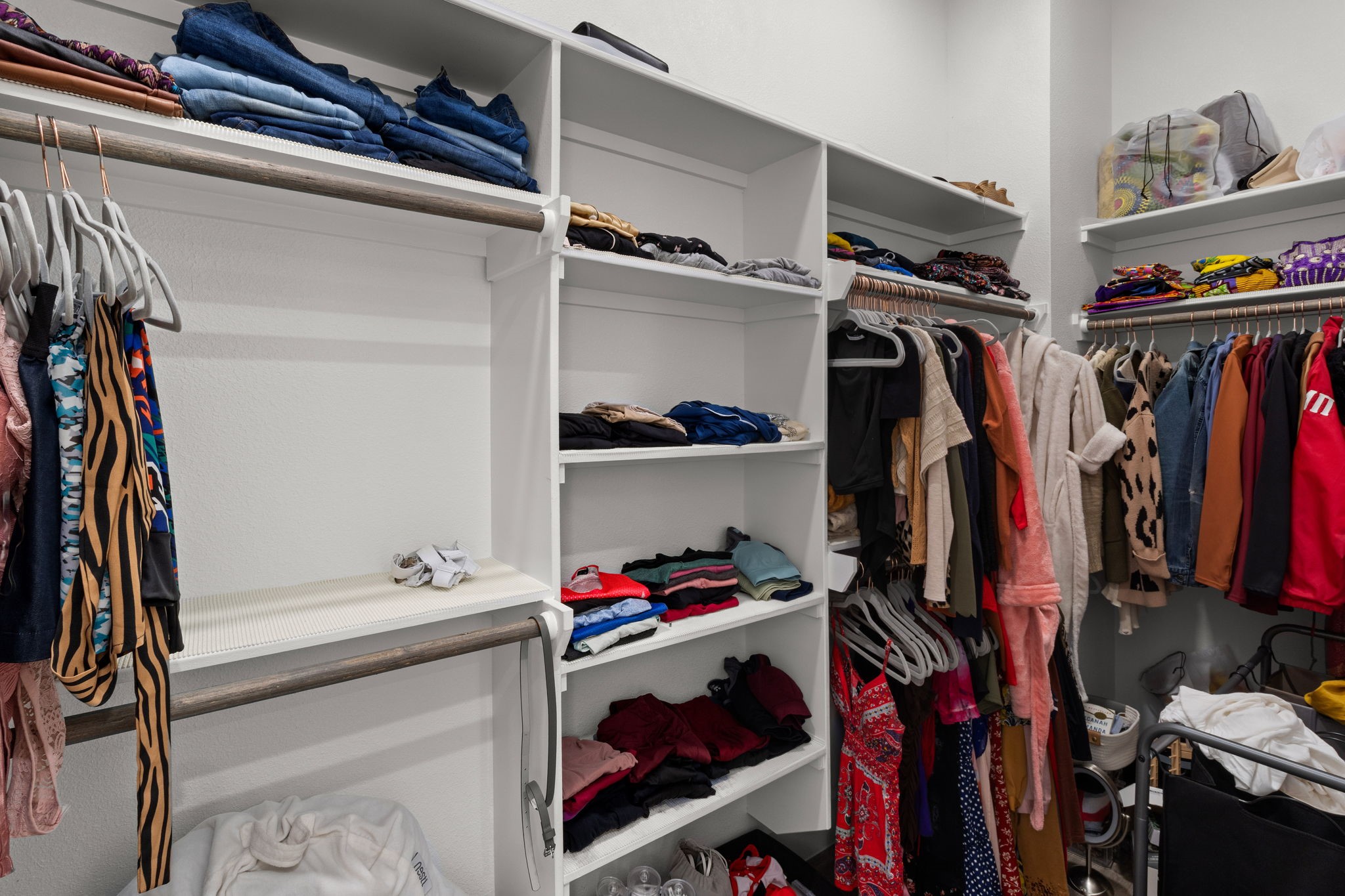 517 Schweikhardt Street Houston, TX 77020 - Photo 21 of 49 a view of walk in closet with clothes and shoes