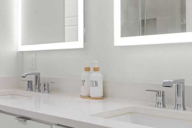 a bathroom with a sink and a mirror