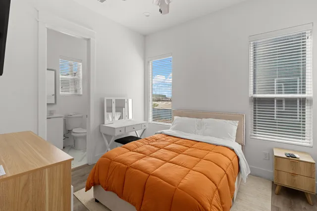 a bedroom with a bed and a window