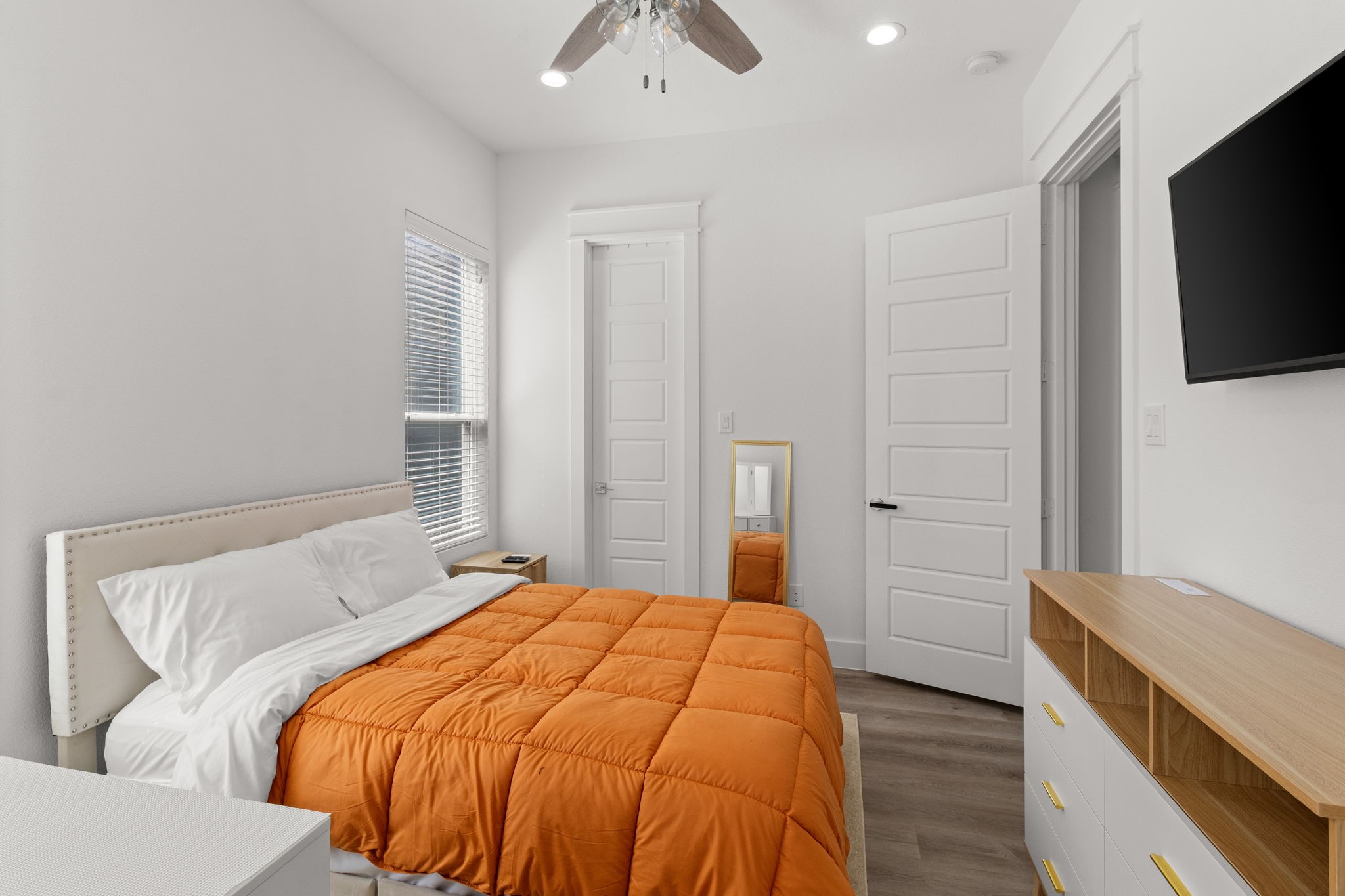 517 Schweikhardt Street Houston, TX 77020 - Photo 34 of 49 a bedroom with a bed and a flat screen tv