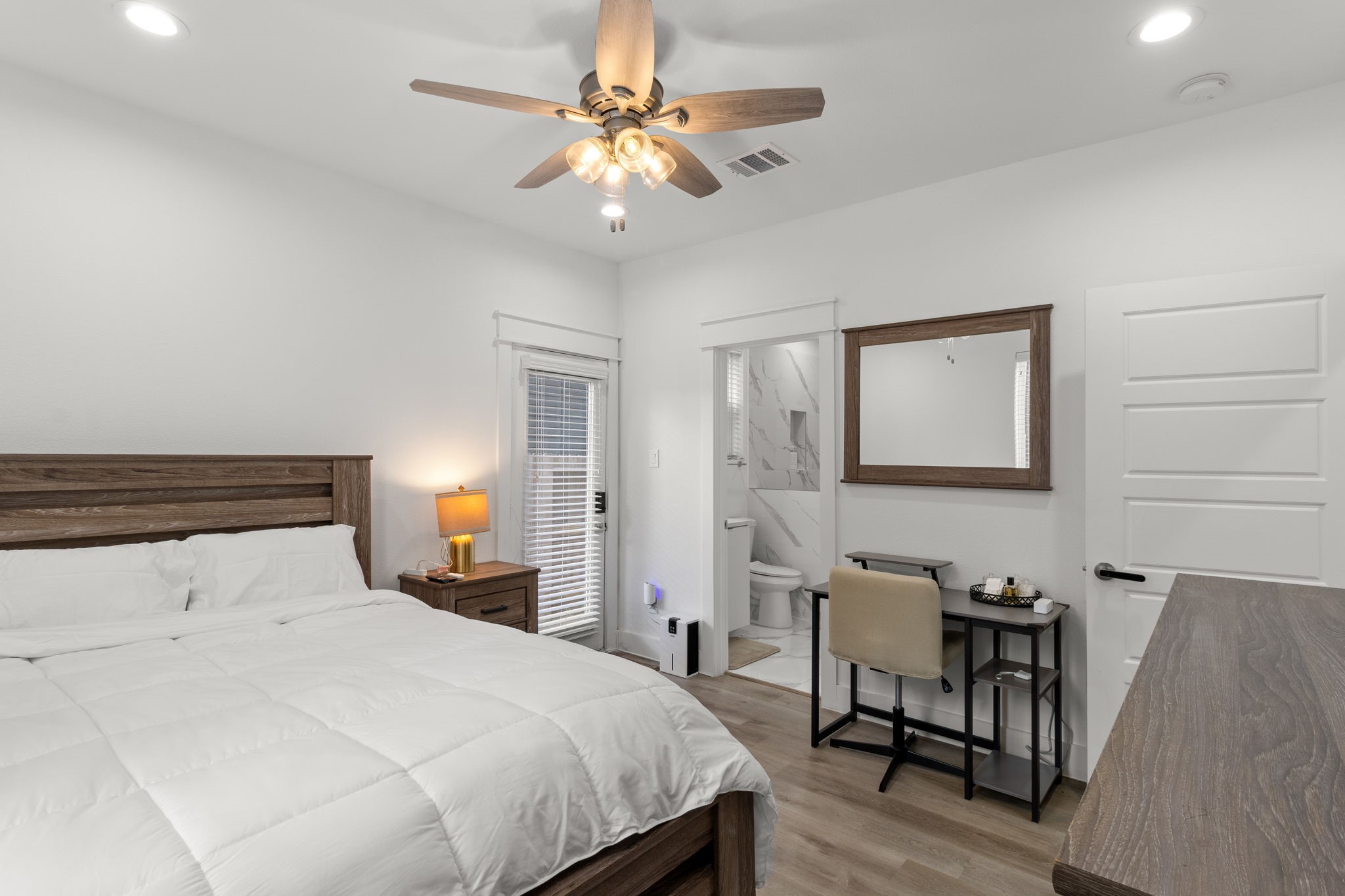 517 Schweikhardt Street Houston, TX 77020 - Photo 40 of 49 a bedroom with a bed and a chandelier