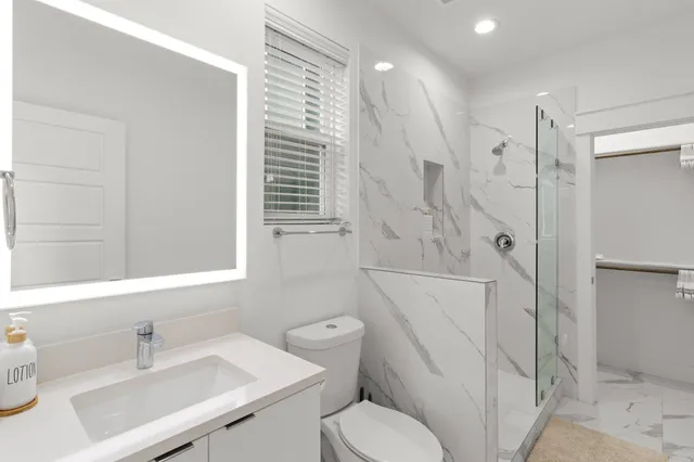 a kitchen with a refrigerator and a stove