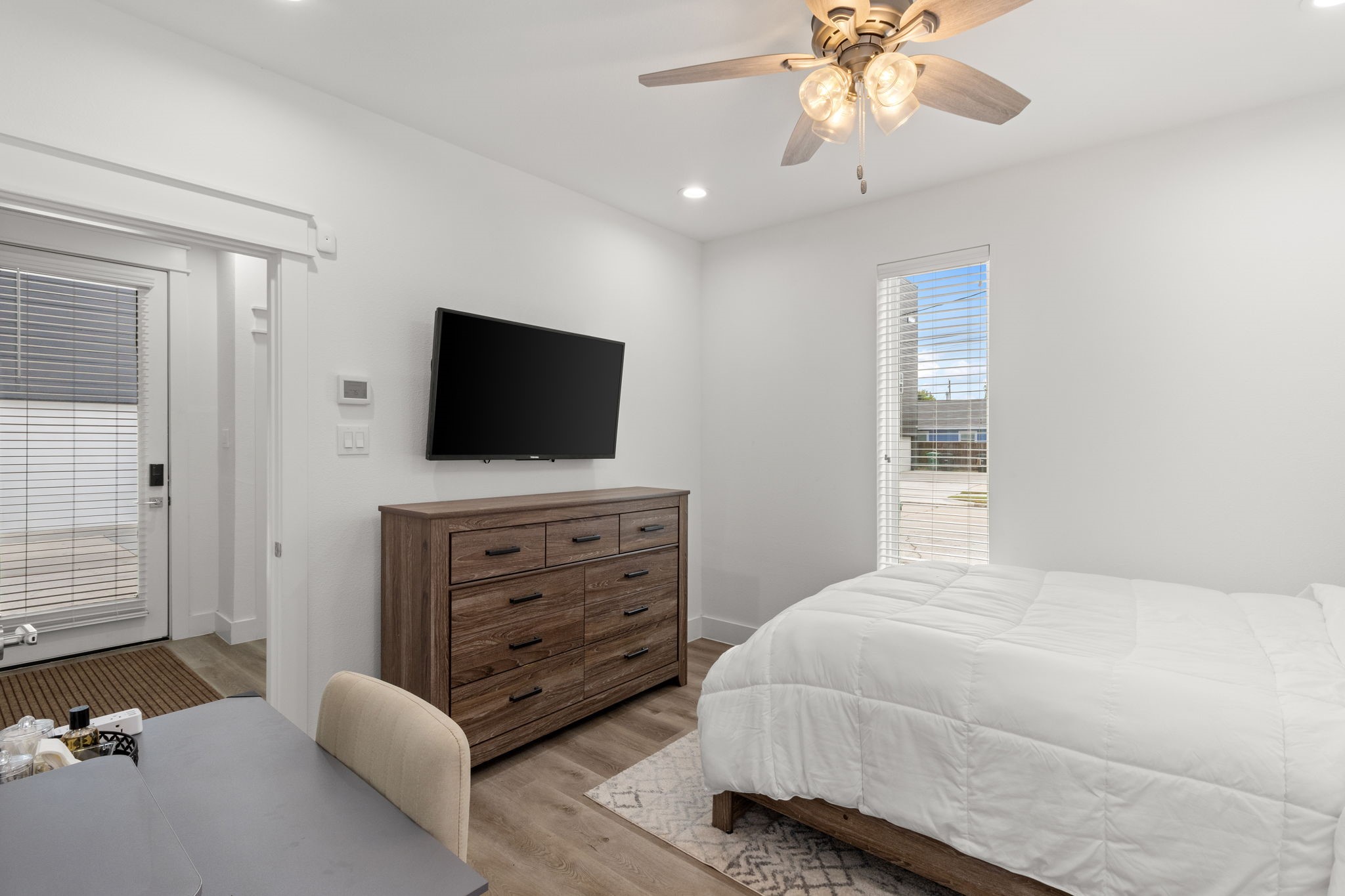 517 Schweikhardt Street Houston, TX 77020 - Photo 42 of 49 a bedroom with a bed and a flat tv screen on dresser