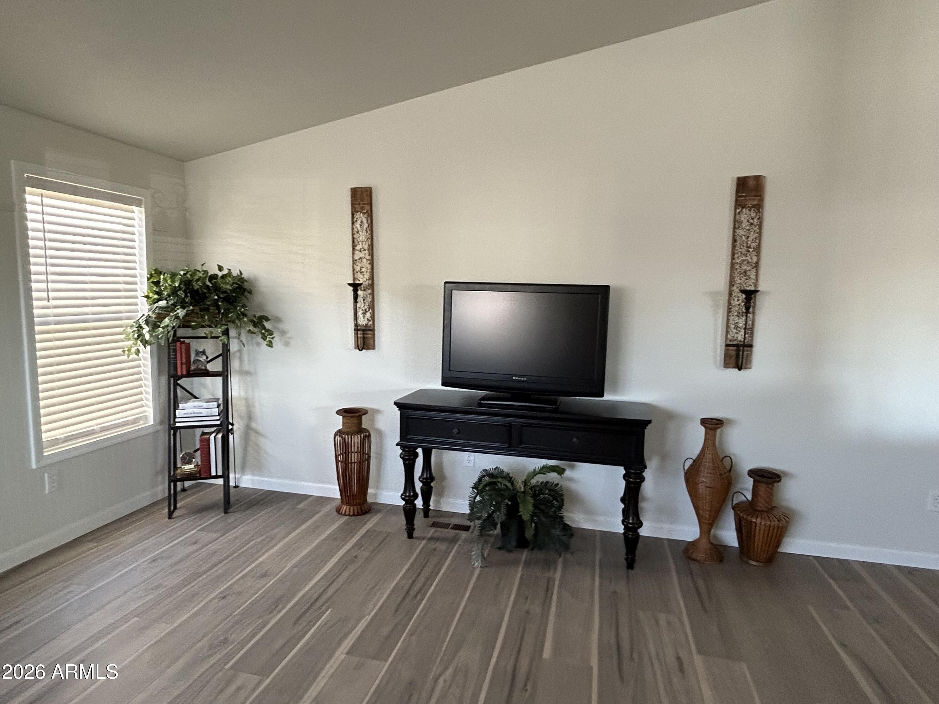 3500 South Tomahawk Road, Unit 217 Apache Junction, AZ 85119 - Photo 15 of 35 a living room with furniture and a flat screen tv