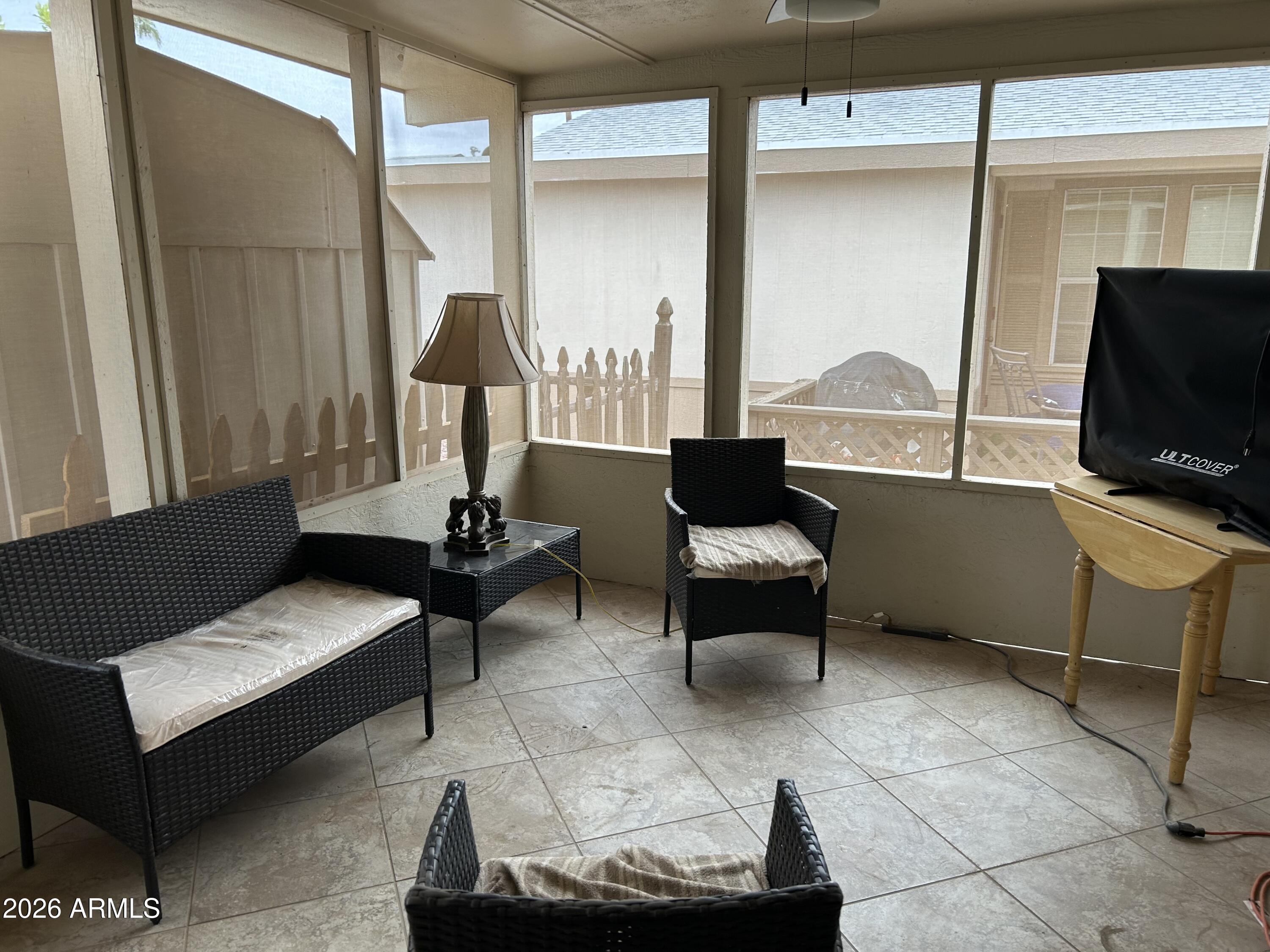 3500 South Tomahawk Road, Unit 217 Apache Junction, AZ 85119 - Photo 25 of 35 a living room with furniture and a flat screen tv