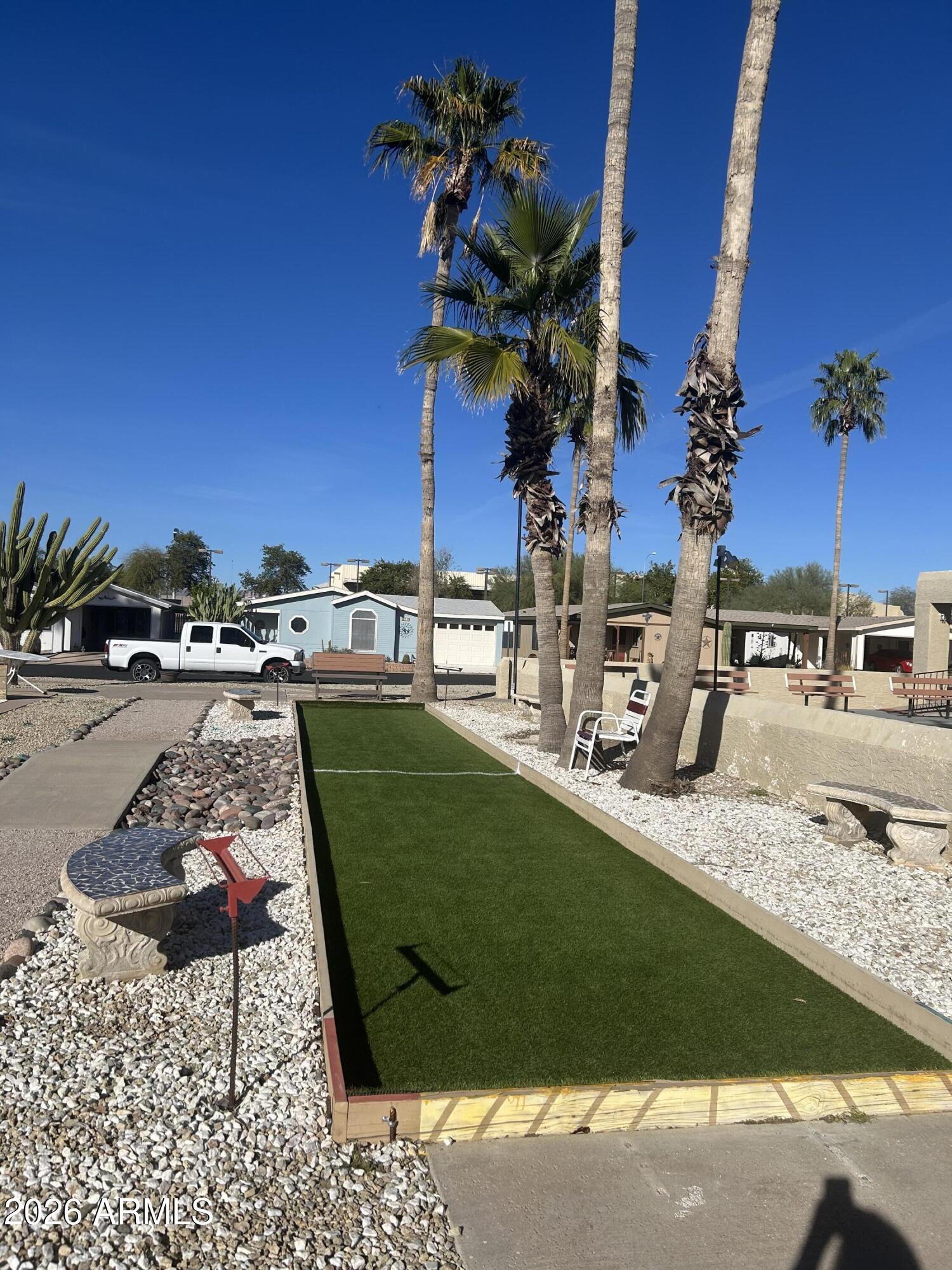 3500 South Tomahawk Road, Unit 217 Apache Junction, AZ 85119 - Photo 26 of 35 a view of a backyard with a patio and lake view
