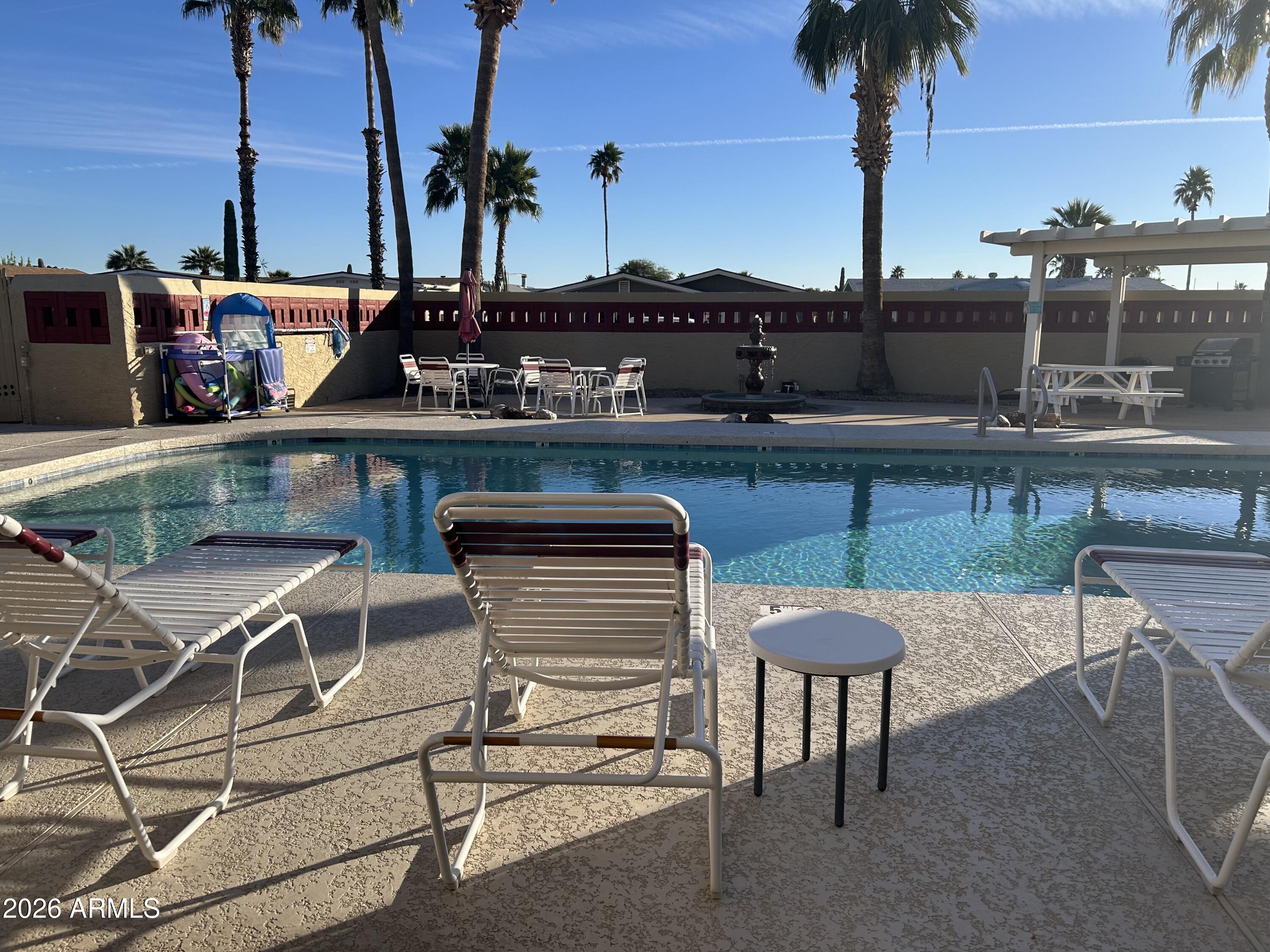 3500 South Tomahawk Road, Unit 217 Apache Junction, AZ 85119 - Photo 35 of 35 a view of a chairs and table on the terrace