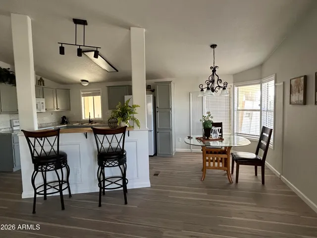 a kitchen with kitchen island a stove a sink and a refrigerator