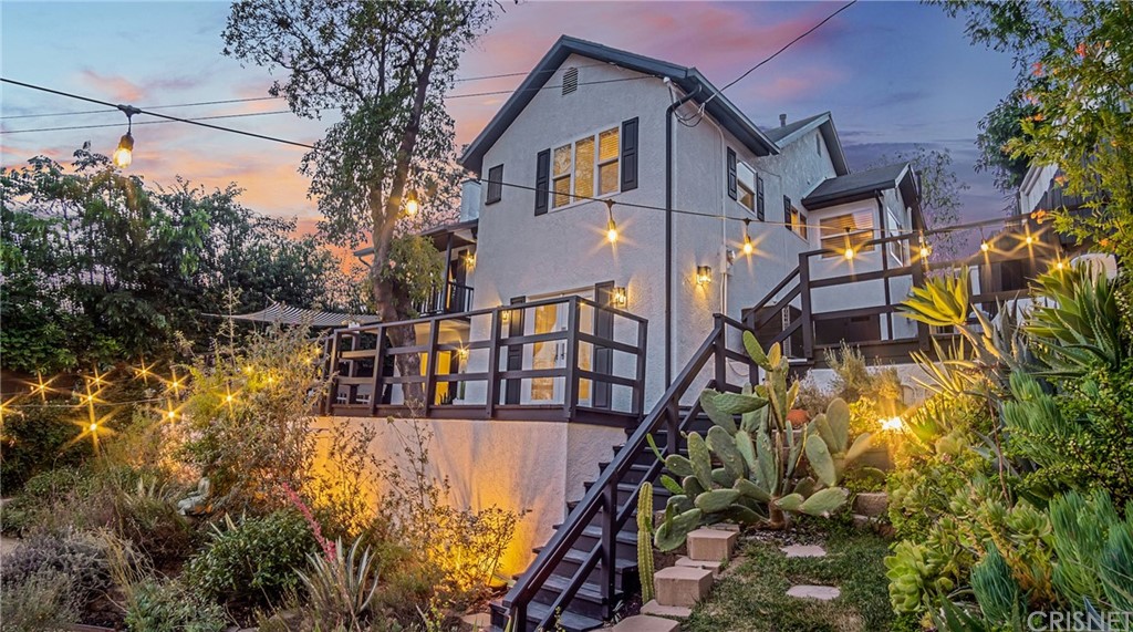 3926 Roderick Road Los Angeles, CA 90065 - Photo 1 of 1 a view of a house with a small yard and large trees