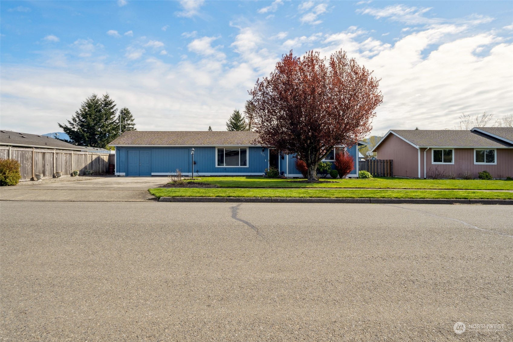 509 Harmony Lane Enumclaw, WA 98022 - Photo 1 of 22 a view of green field with house in the background
