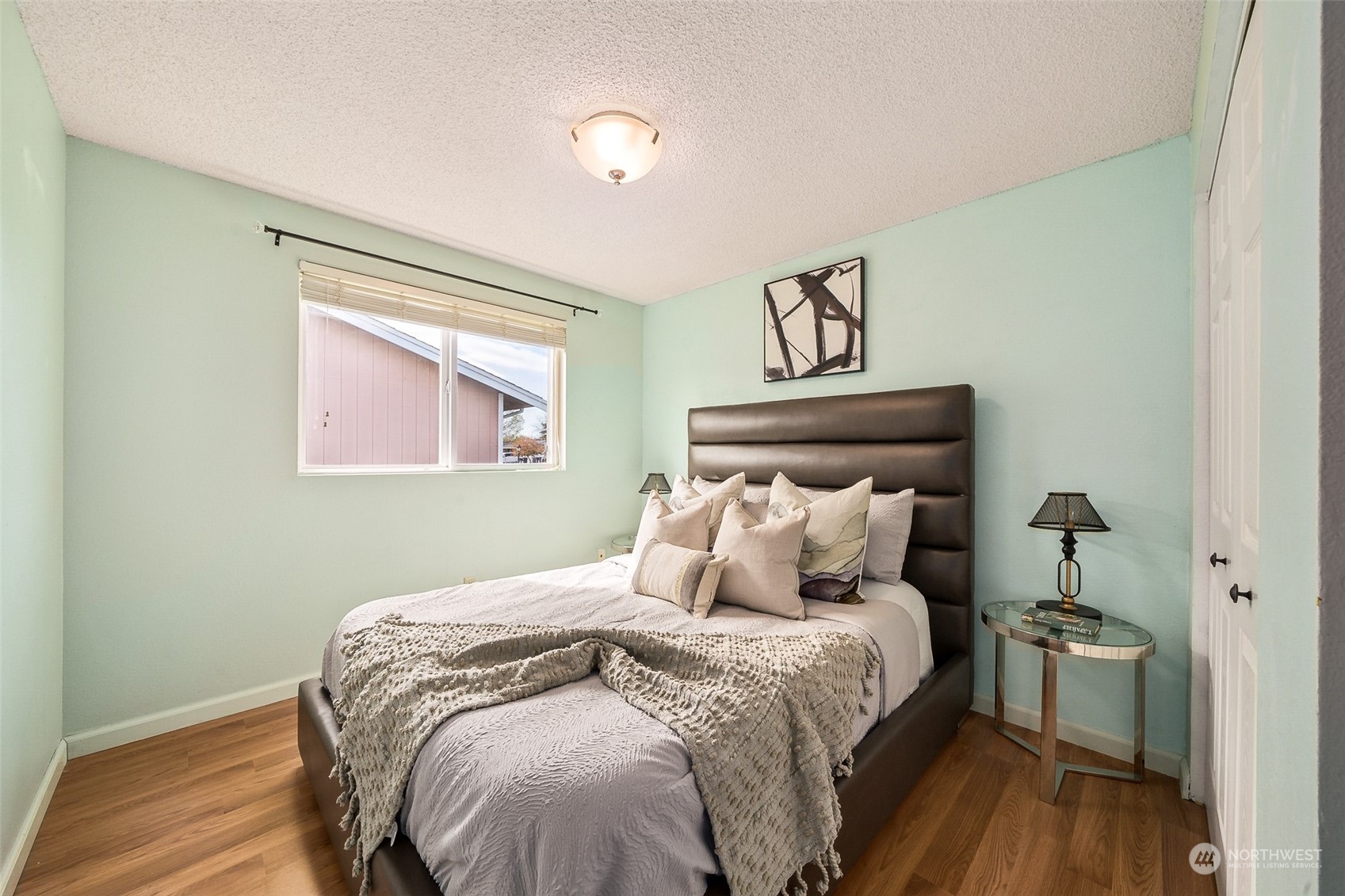 509 Harmony Lane Enumclaw, WA 98022 - Photo 11 of 22 a bedroom with a bed and wooden floor