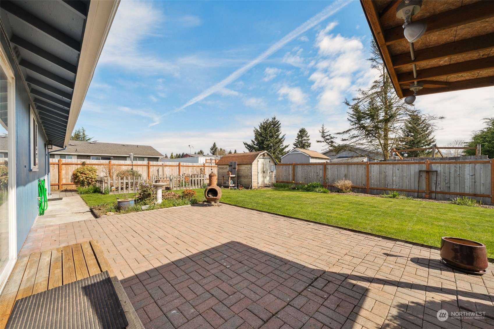 509 Harmony Lane Enumclaw, WA 98022 - Photo 18 of 22 a view of a backyard with sitting area