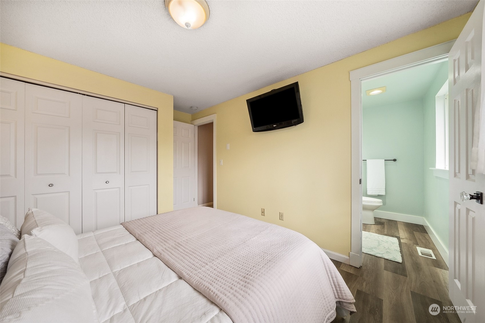 509 Harmony Lane Enumclaw, WA 98022 - Photo 9 of 22 a bedroom with a bed and a flat screen tv