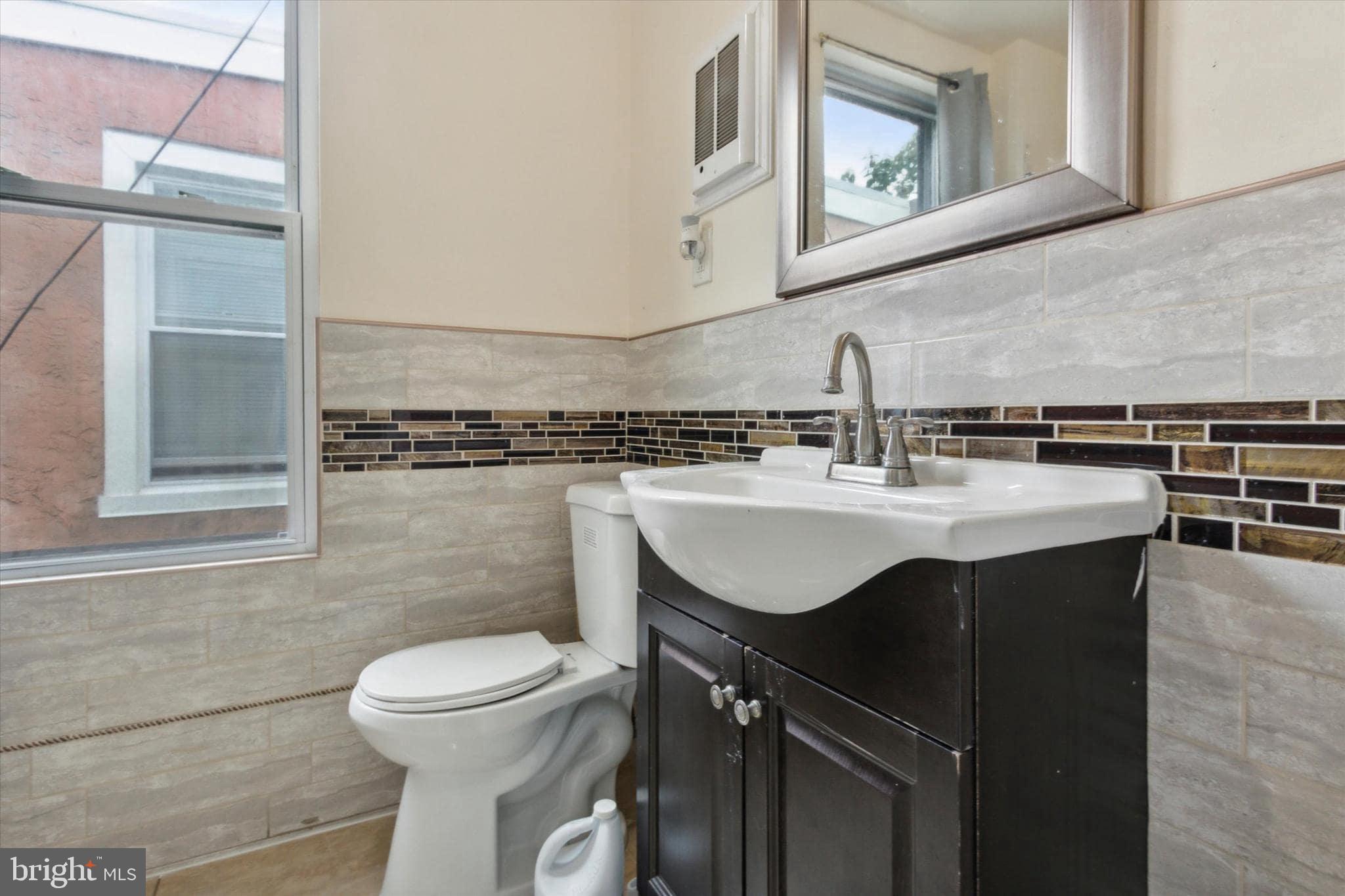 1933 Page Street Philadelphia, PA 19121 - Photo 16 of 19 a bathroom with a sink and a toilet