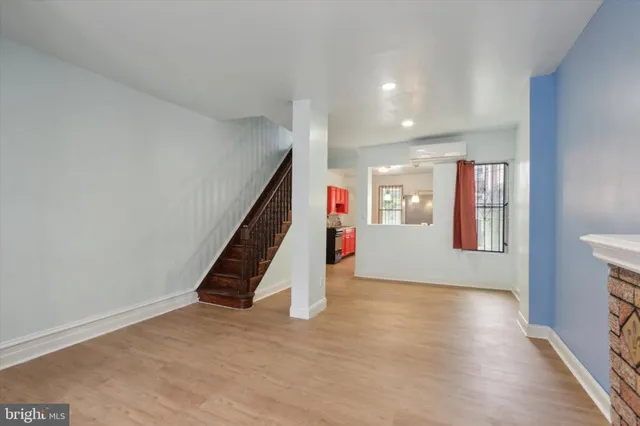 a view of an empty room with stairs