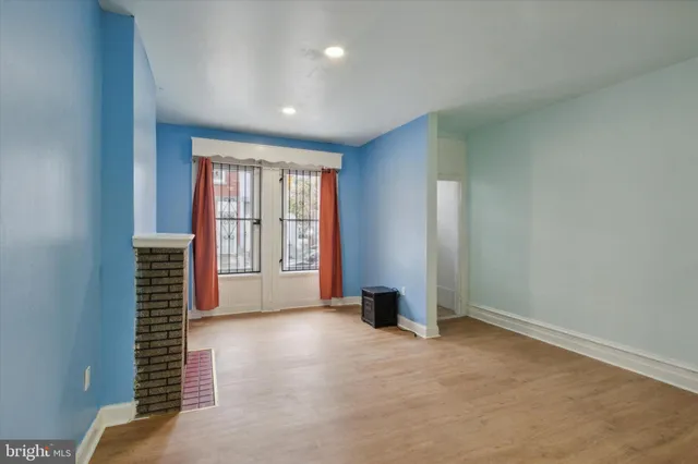 a kitchen with stainless steel appliances granite countertop a sink stove and wooden floor