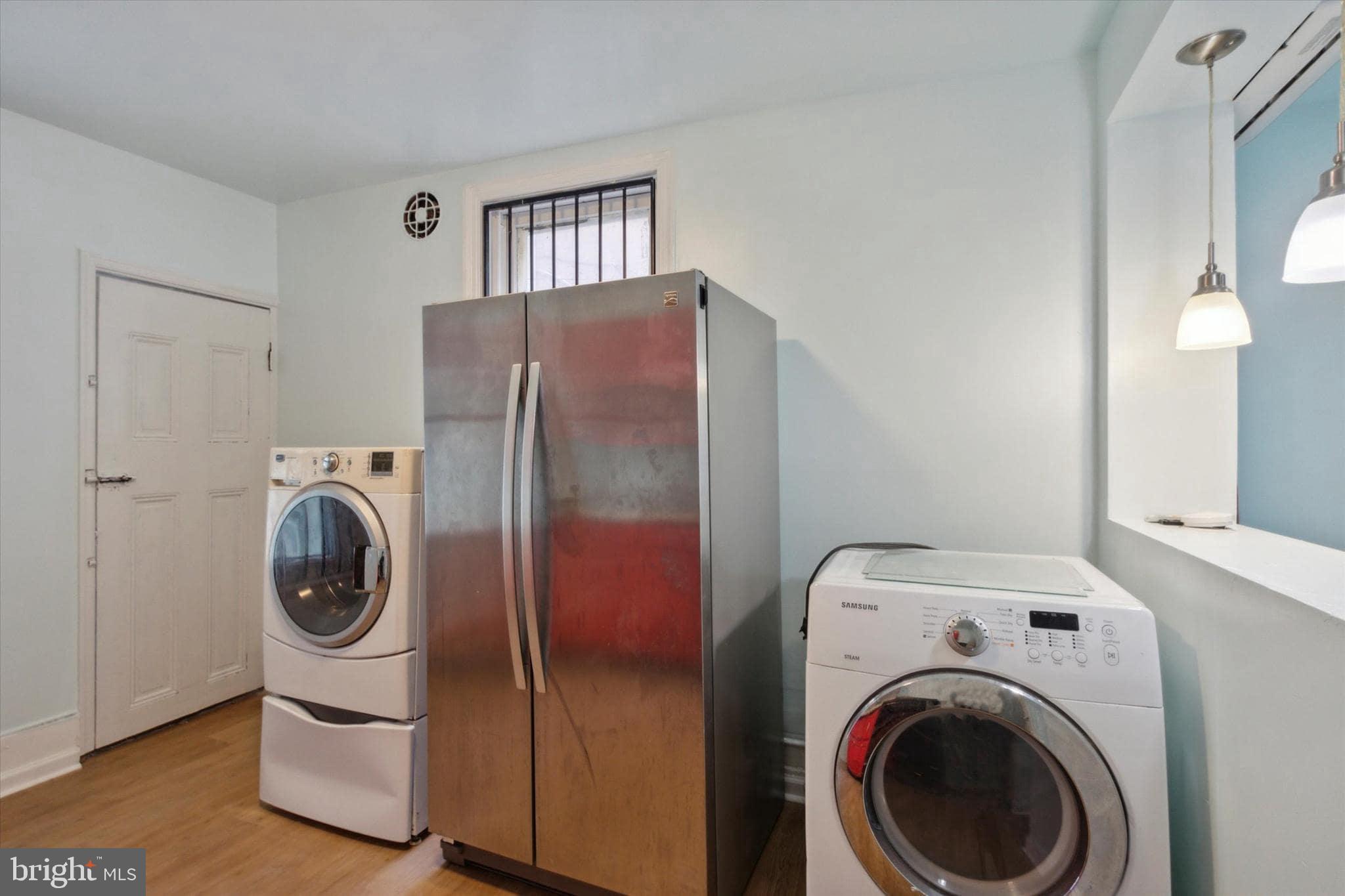 1933 Page Street Philadelphia, PA 19121 - Photo 7 of 19 a utility room with dryer and washer