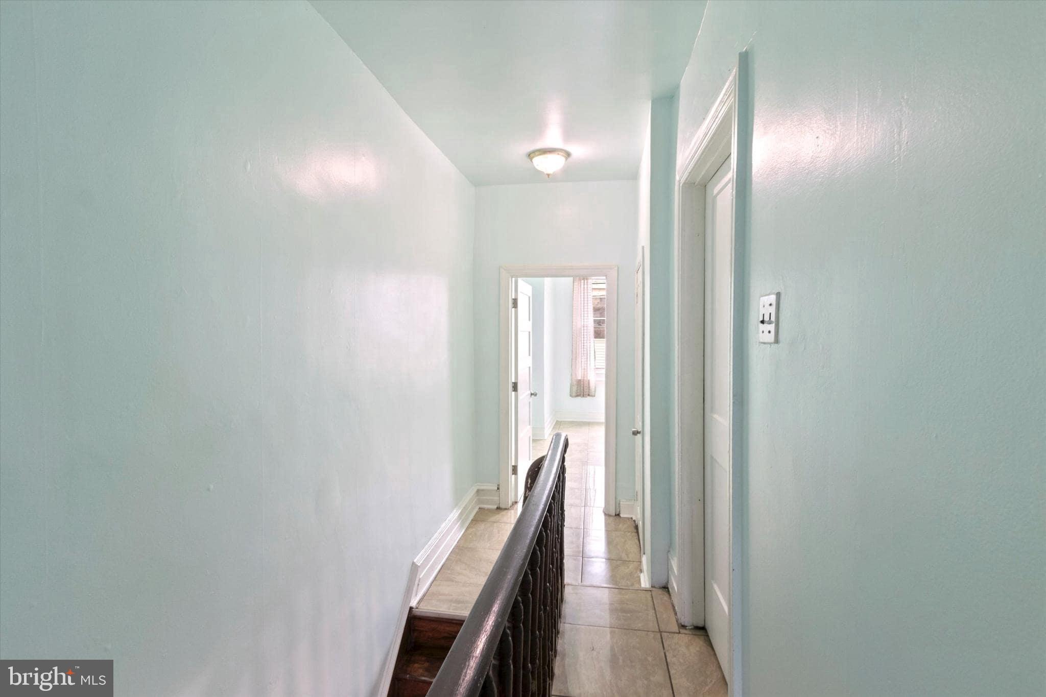 1933 Page Street Philadelphia, PA 19121 - Photo 8 of 19 a view of a hallway with wooden floor