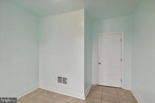 a view of empty room with a flat screen tv