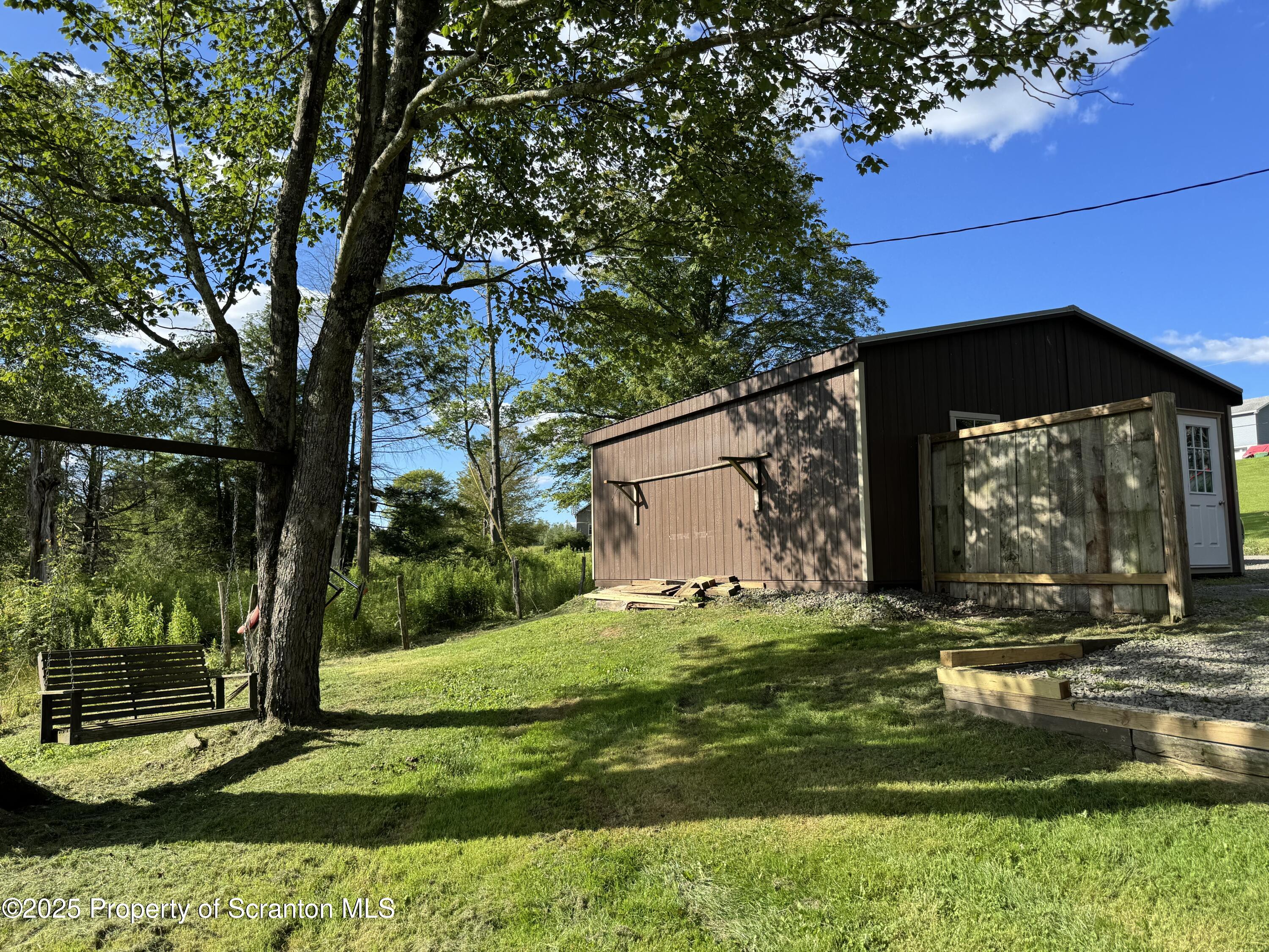 131 Ball Pond Road Thompson, PA 18465 - Photo 3 of 21 a view of a house with a yard