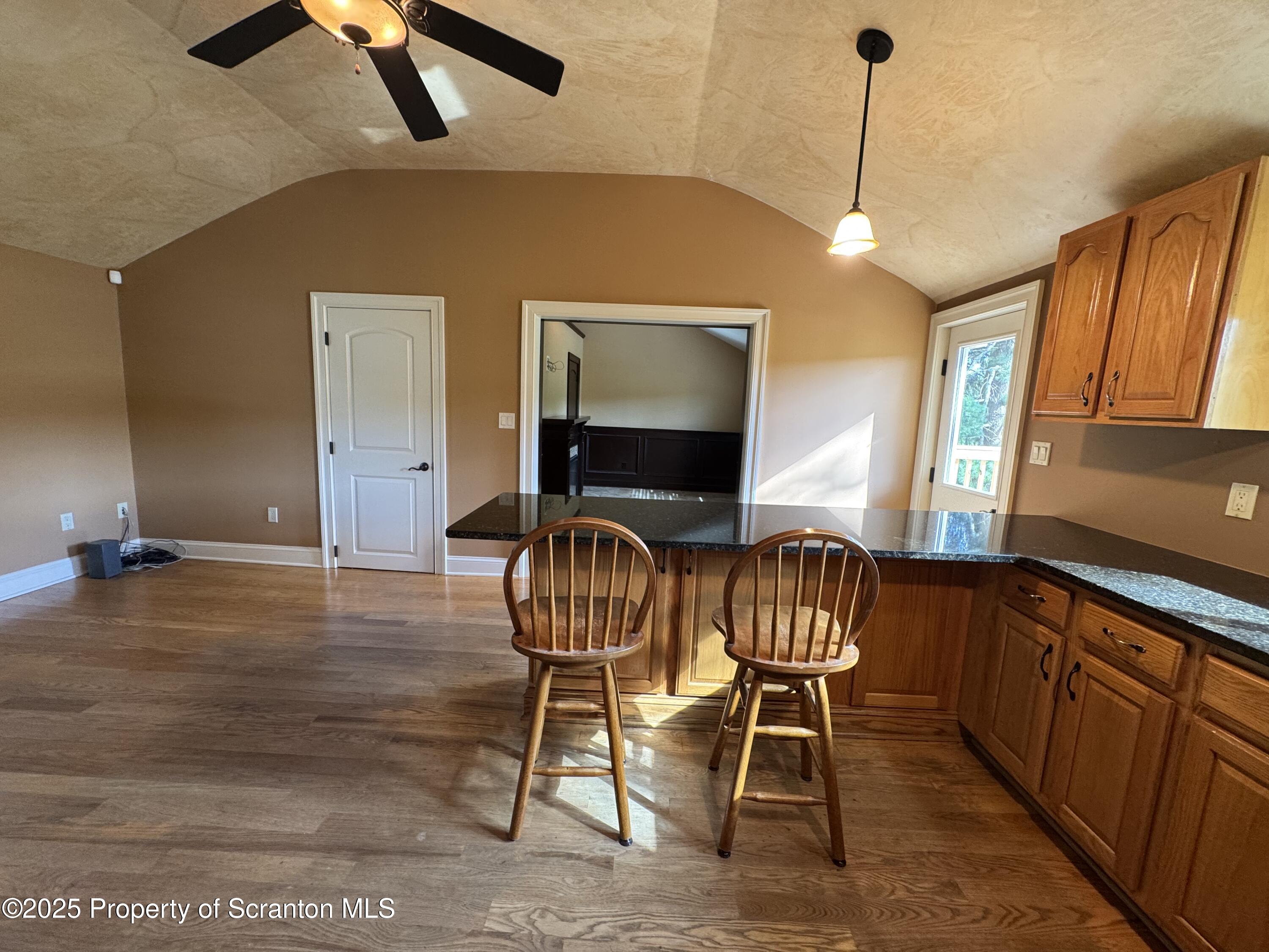 131 Ball Pond Road Thompson, PA 18465 - Photo 5 of 21 a view of a livingroom with furniture wooden floor and windows