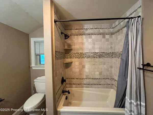 a bathroom with a sink a mirror and vanity