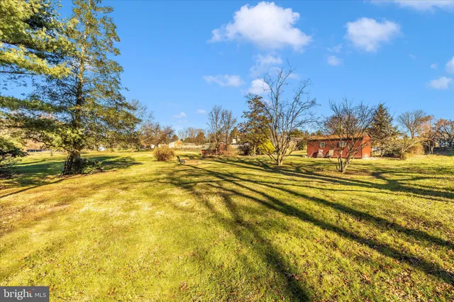 a view of a swimming pool with an outdoor space and seating area