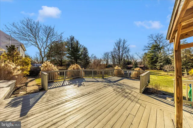 a view of a house with a large window and sitting area