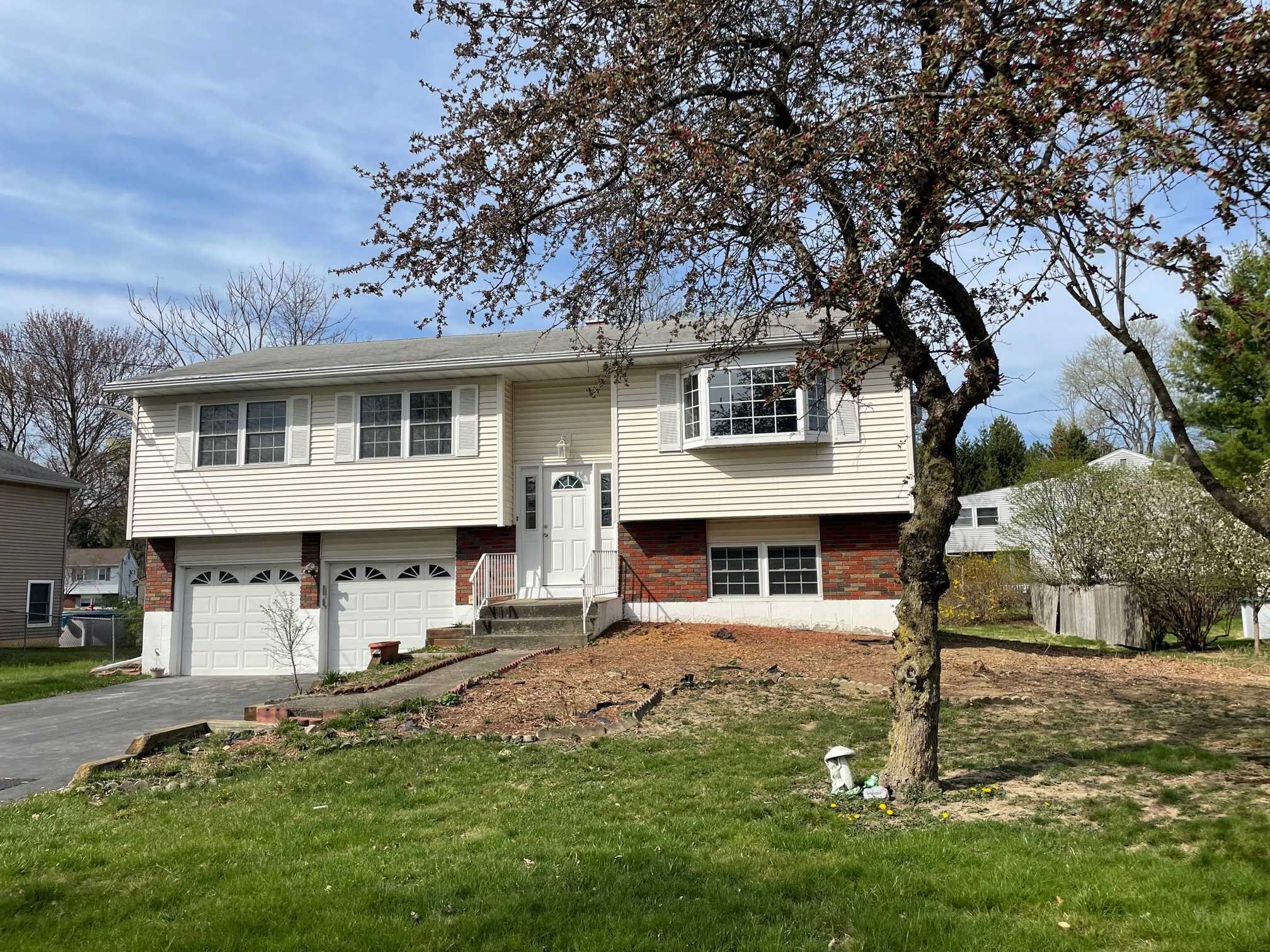 a front view of a house with a yard
