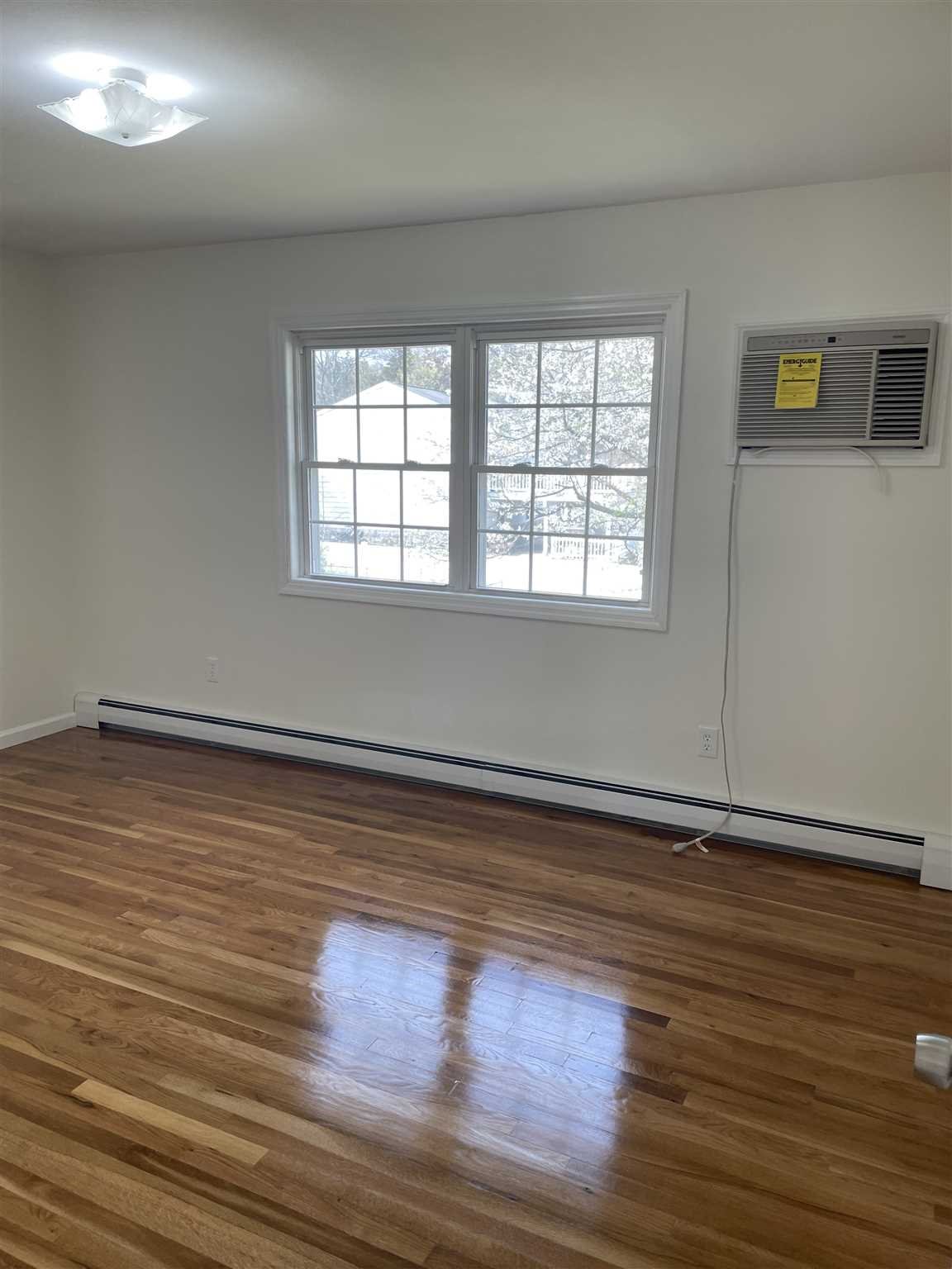 36 Sutton Park Road Poughkeepsie, NY 12603 - Photo 11 of 17 a view of empty room with wooden floor and fan