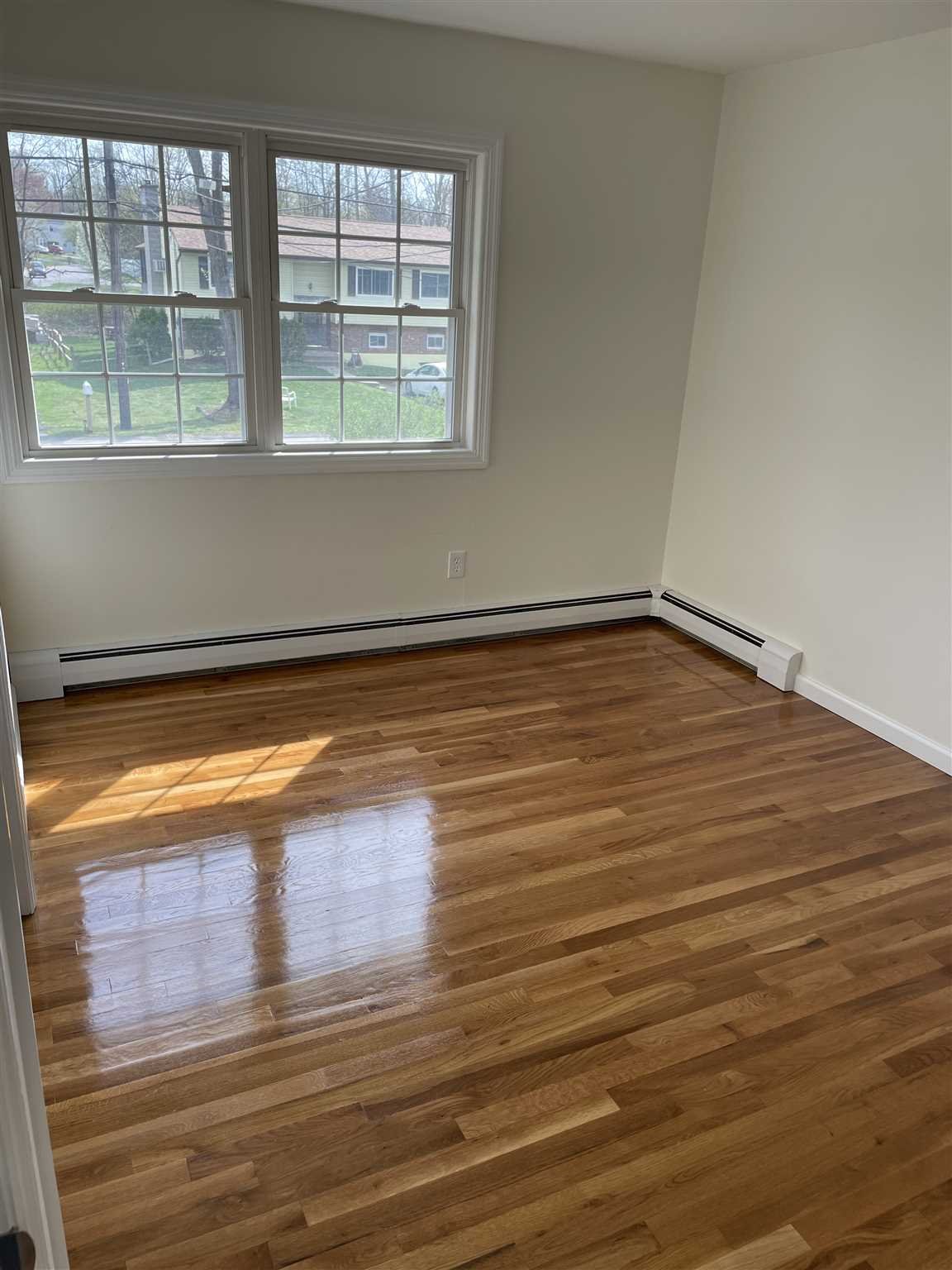 36 Sutton Park Road Poughkeepsie, NY 12603 - Photo 12 of 17 a view of empty room with wooden floor and fan