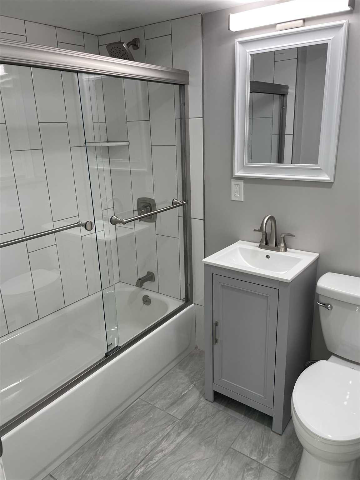 36 Sutton Park Road Poughkeepsie, NY 12603 - Photo 15 of 17 a bathroom with a sink toilet and shower