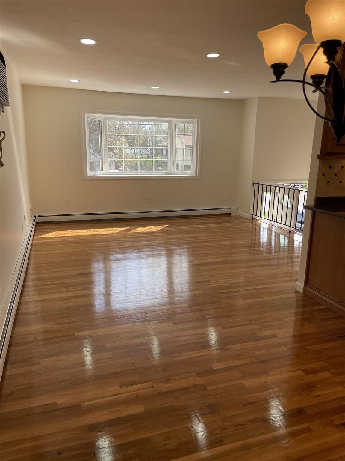36 Sutton Park Road Poughkeepsie, NY 12603 - Photo 6 of 17 a view of empty room with wooden floor and fan