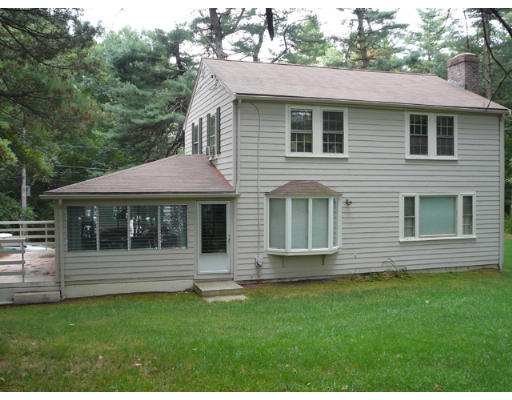 347 Dutton Road Sudbury, MA 01776 - Photo 12 of 16 a front view of a house with a yard