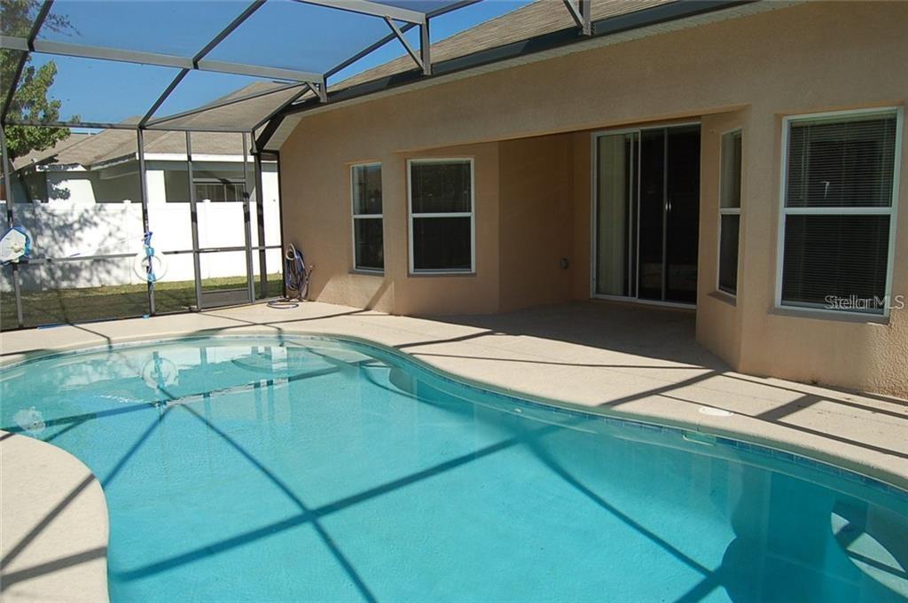 3103 Rawcliffe Road Clermont, FL 34714 - Photo 13 of 17 a house view with a backyard space