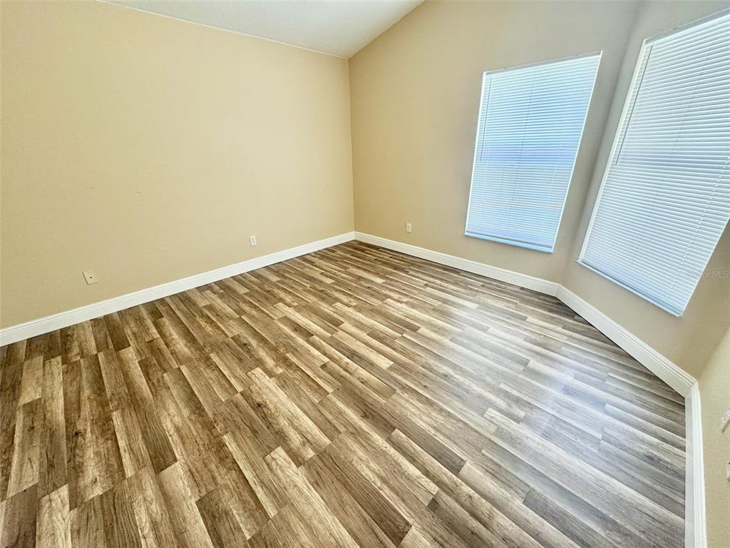 3103 Rawcliffe Road Clermont, FL 34714 - Photo 8 of 17 a view of wooden floor and brick walls